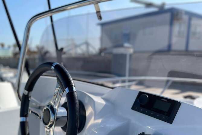 Boat Rental Without License in La Marina de Valencia - Boat comfort for families: shade, ladder, Bluetooth, and the cool box