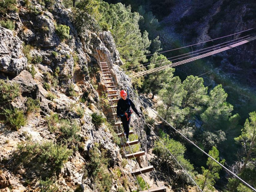 Enguera - First meters matter: the stone wall climb on iron clamps