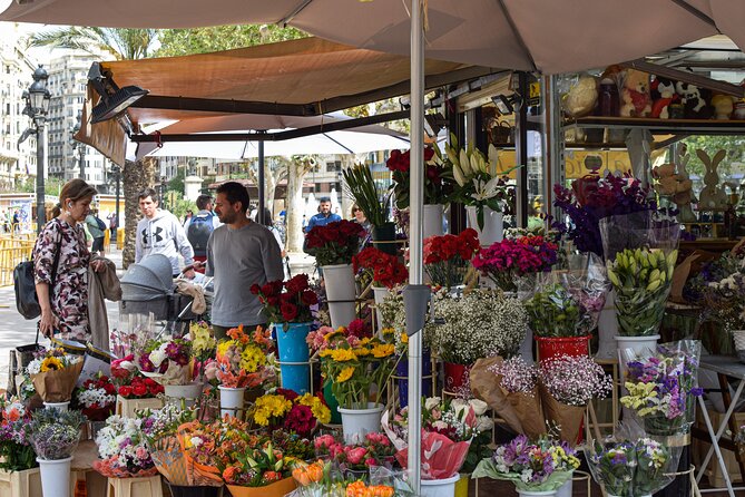 Valencia Centre Food Tour with 9+ Tastings of Regional Delicacies - Stop 3: Old Town Stroll to Mussels and a Regional Delicatessen at Carrer de la Puríssima, 1