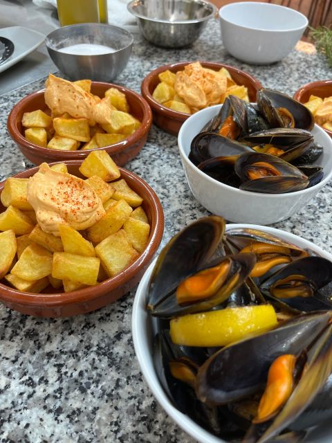 Valencia: Evening Guided Paella Workshop, Tapas, and Drinks - Sweet finish in Valencian style: coca de llanda, fruit, coffee, mistela