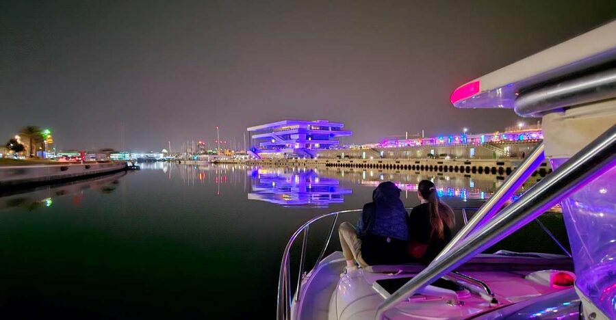 Valencia: Night Cruise with Free Drink - La Marina de València after dark: where the city looks “mapped”