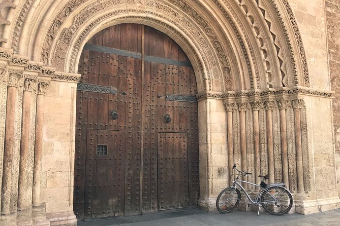 Valencia Old Town Private Tour by Bike or Electric Ride - Plaça de l’Almoina (Kilometre 0): Roman Valencia Underfoot
